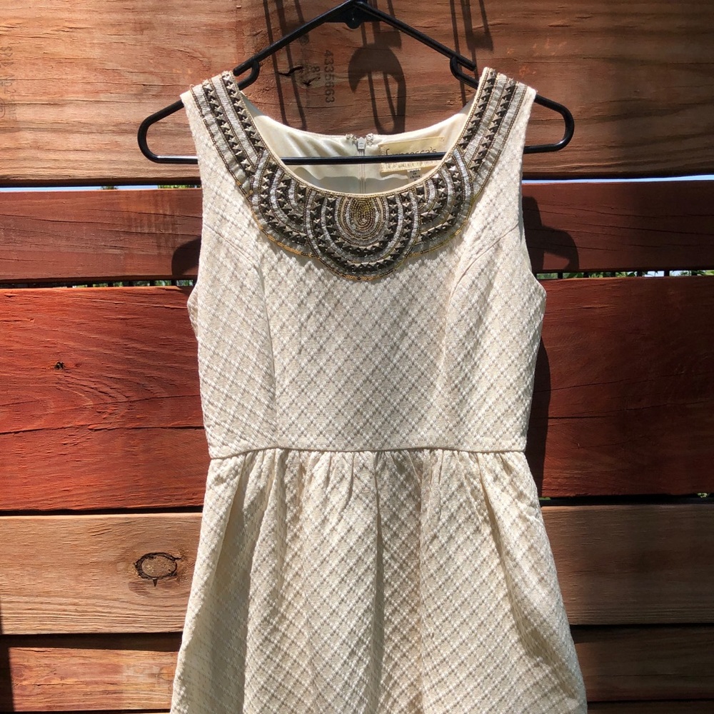 Cream colored sleeveless dress